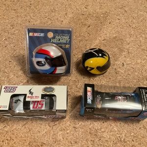 Nascar lot 2 1:64 die cast cars and 2 collectible helmets